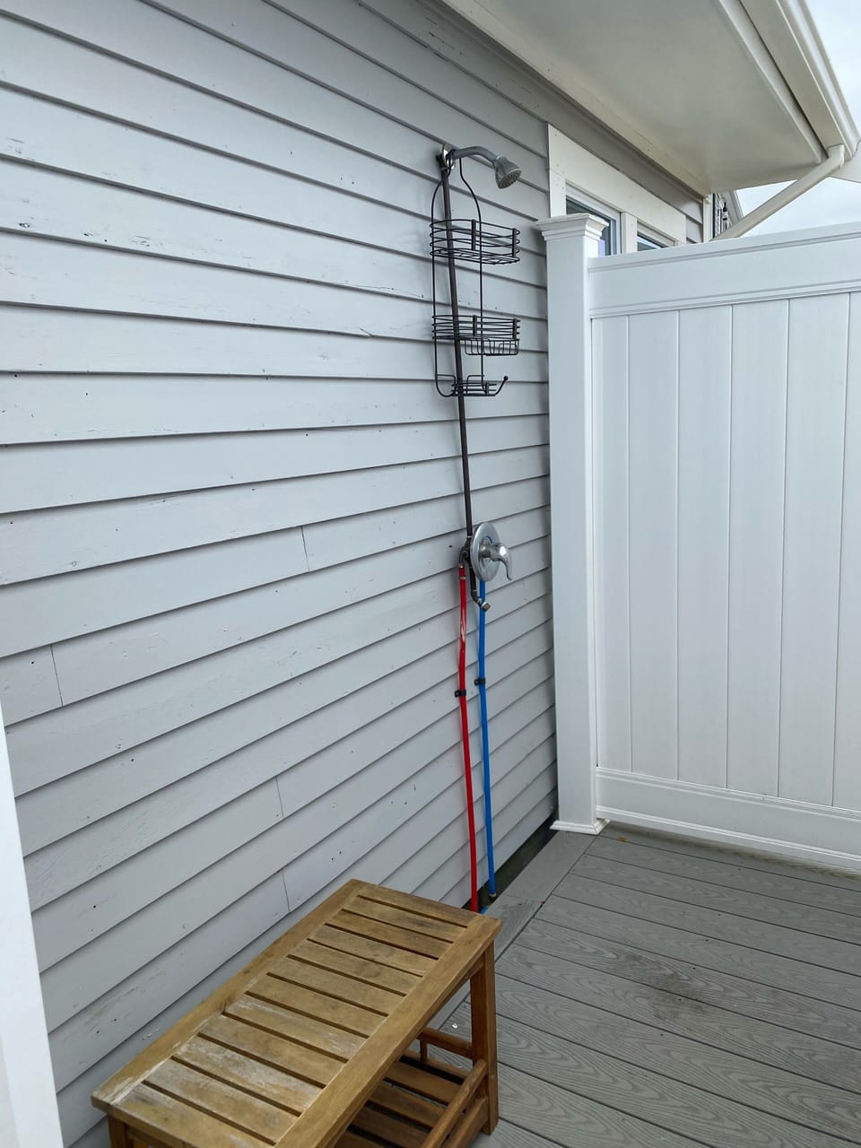 Large outdoor shower with room to change. 