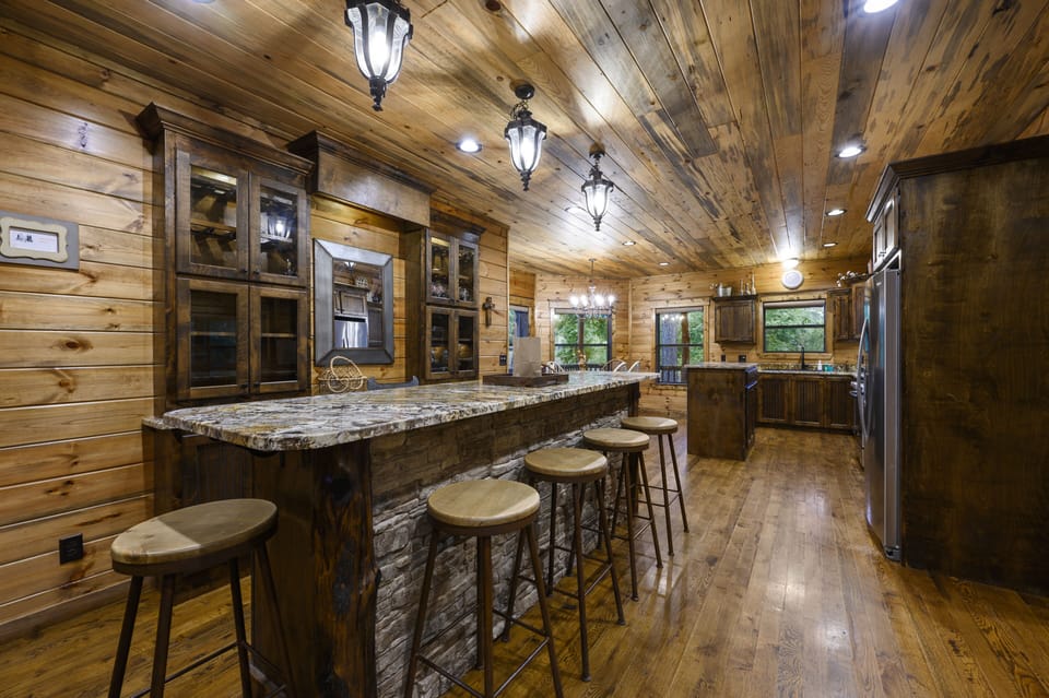 6 seats at the bar in the kitchen.