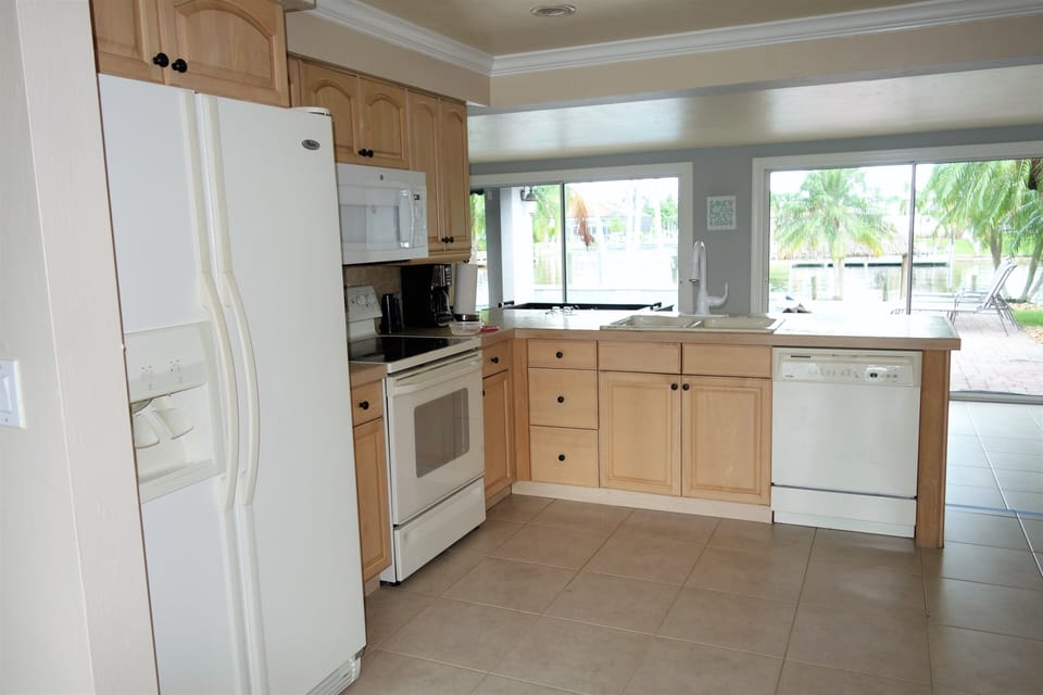 Kitchen area with ice making fridge