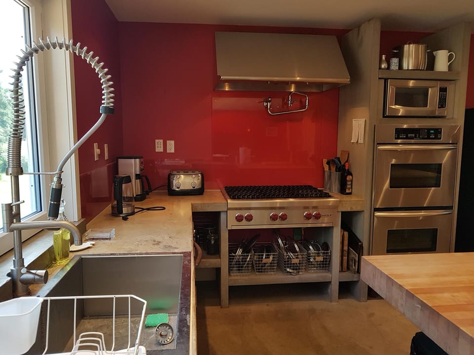 Wolf gas range and double wall oven.
