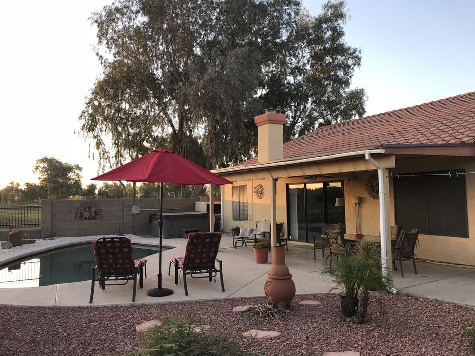 Comfortable seating in the fenced in back yard which overlooks the golf course.