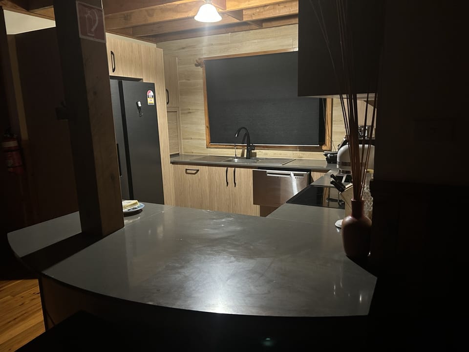 Night shot of new kitchen with new fridge and icemaker