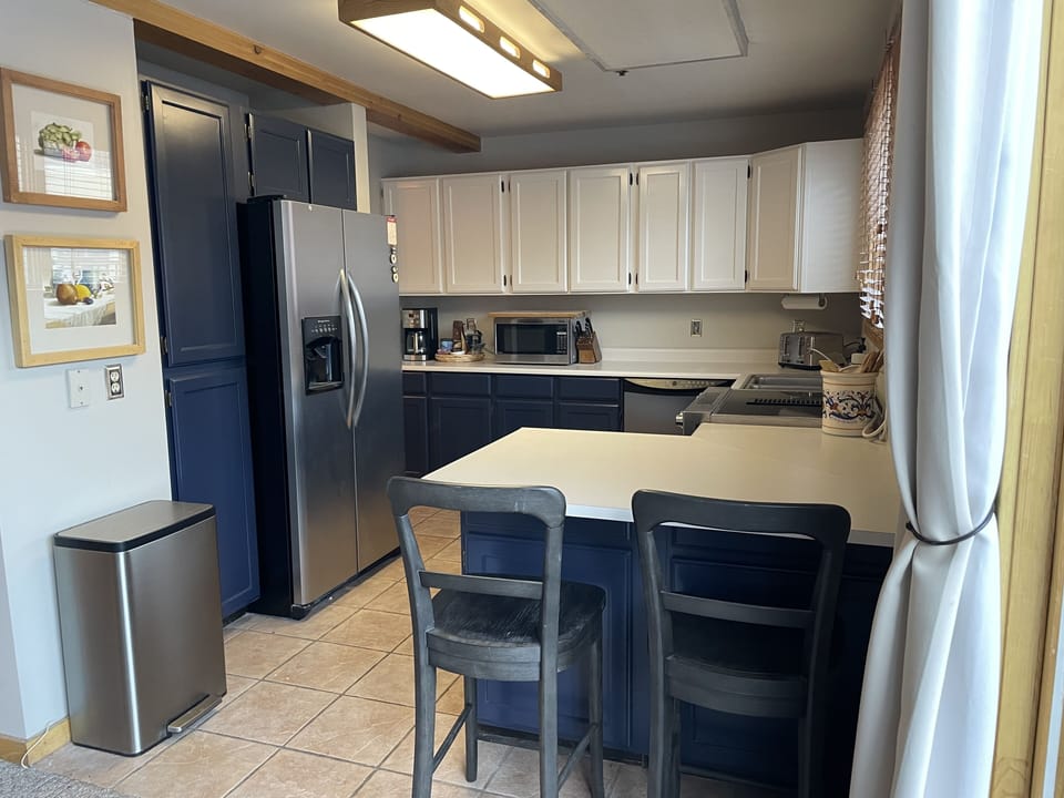 The kitchen is fully equipped.  It has an electric kitchen-aid cooktop and oven.