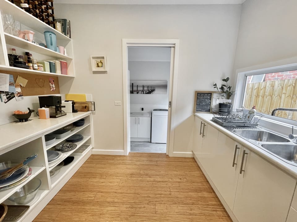 Well-stocked Butlers Pantry with appliances and 2nd sink.