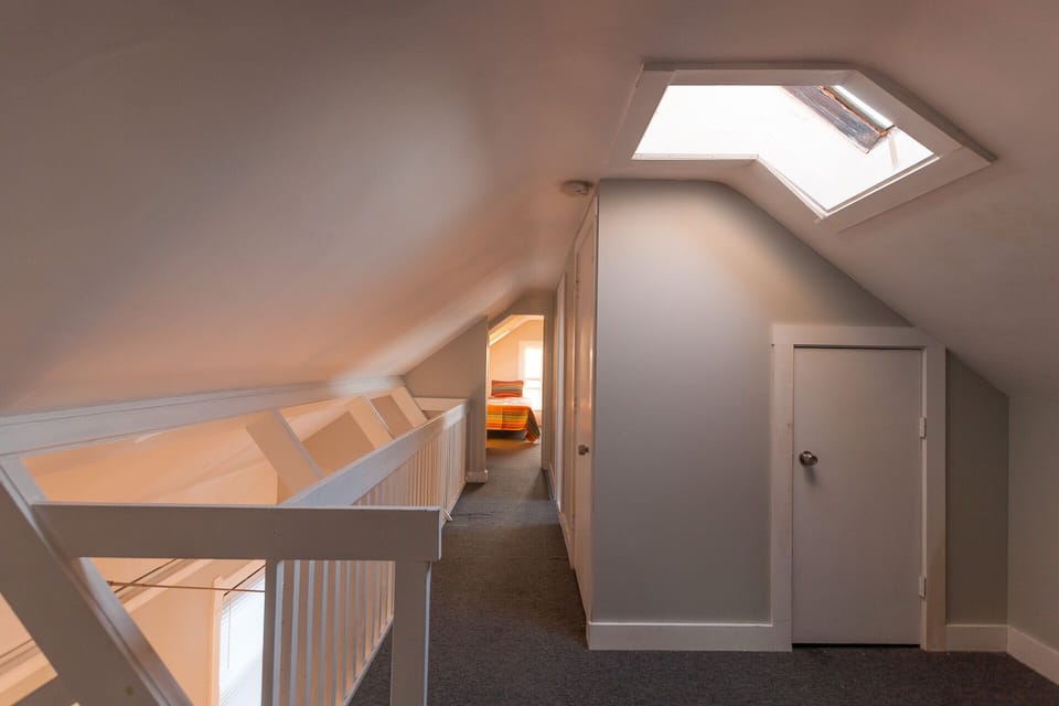 4th floor balcony and passage to bathroom, washer dryer stack, and last bedroom.