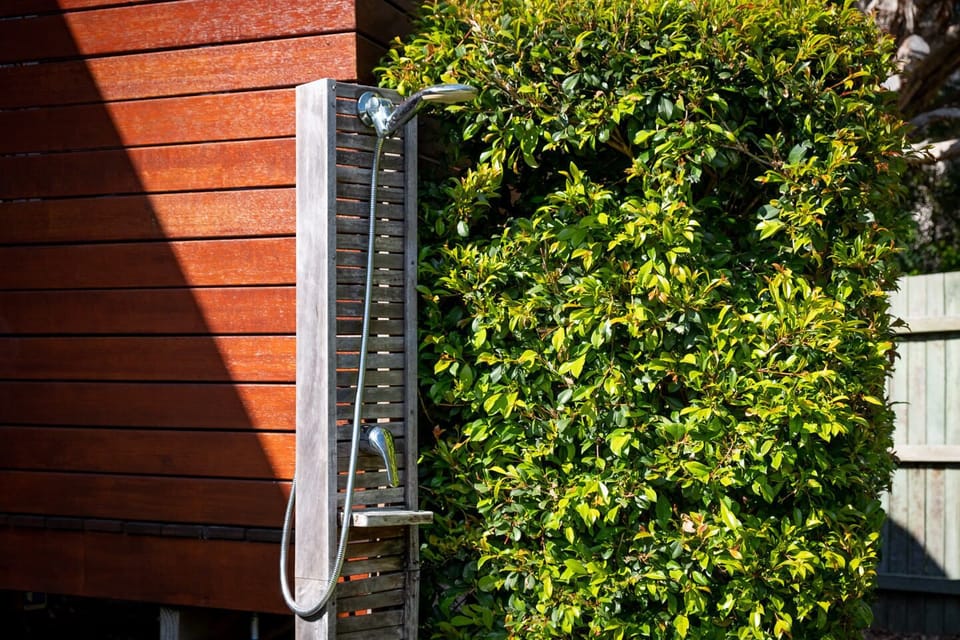 A hot and cold outdoor shower to wash off in comfort after the beach