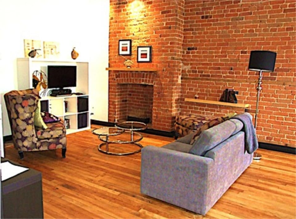Living room with ethanol fireplace and sofa-bed