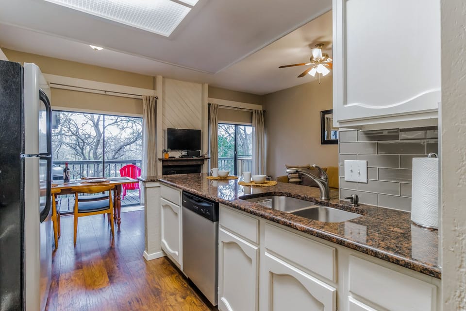 Kitchen looking to dining/balcony