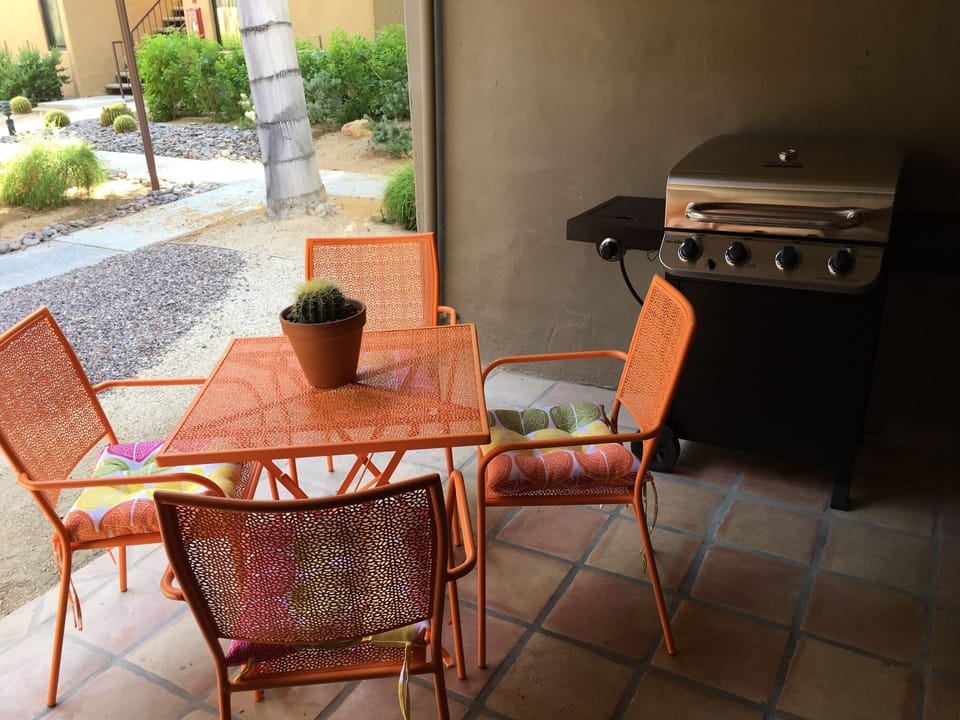 Patio with dining and gas grill