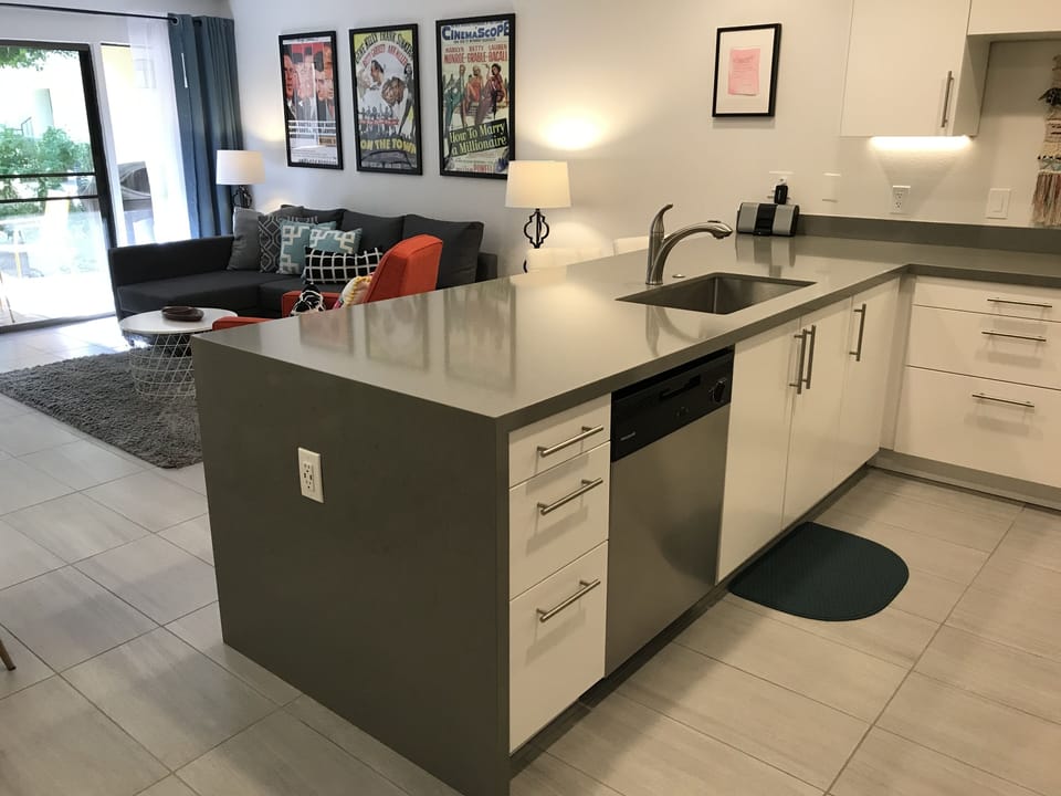 Remodeled kitchen with dishwasher and large sink