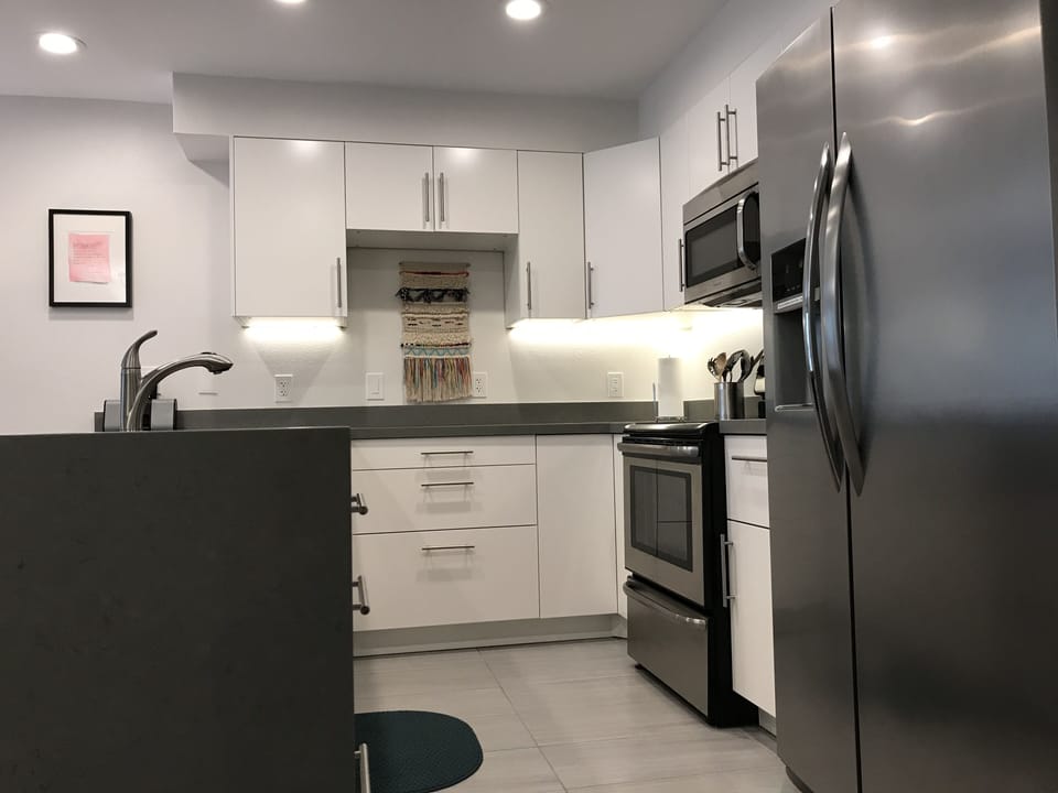Remodeled kitchen with glass top electric stove 