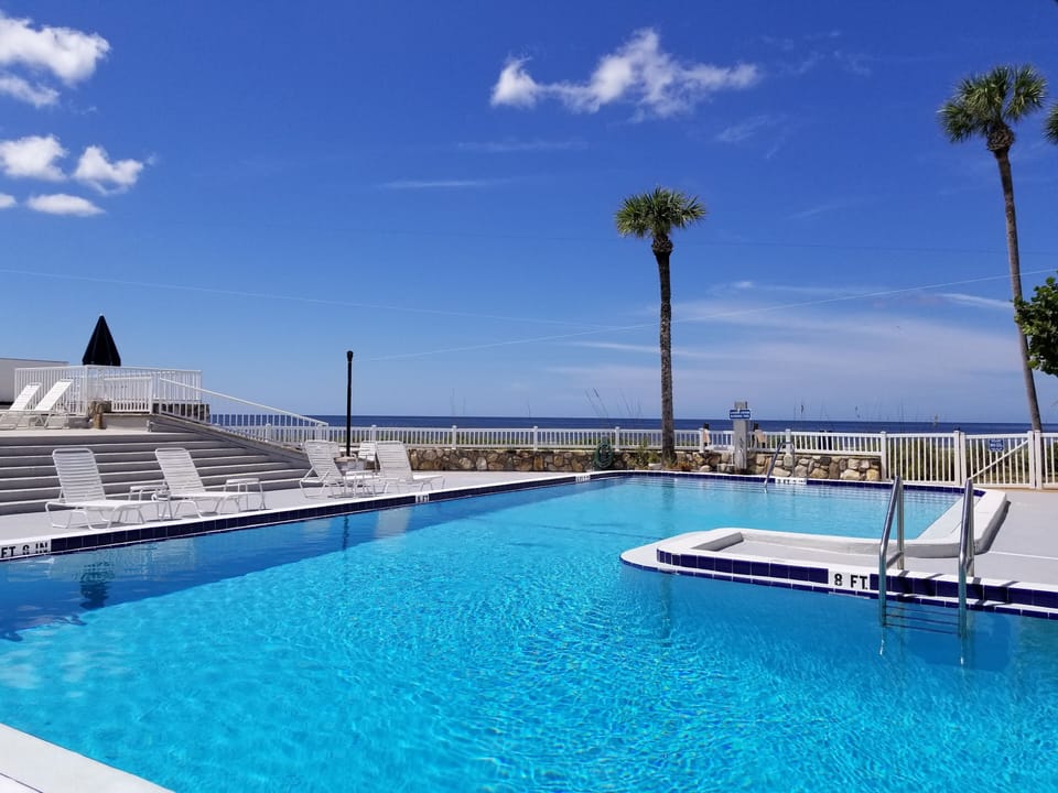 Community heated pool situated directly on the beach.