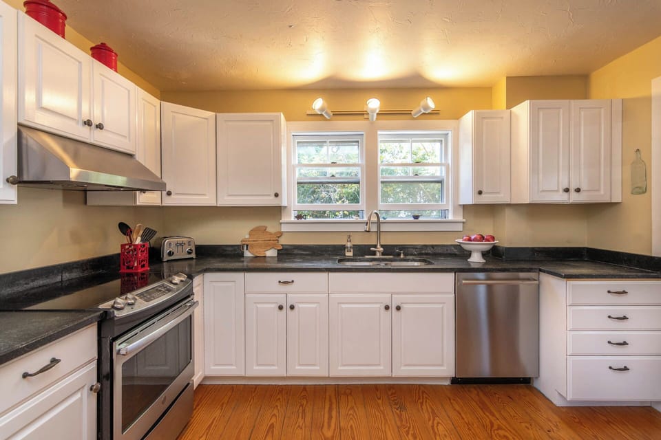Large sunny kitchen for group meal prep, grilling, gathering!