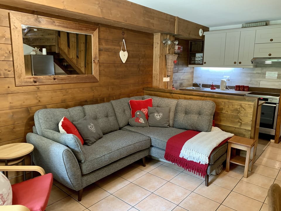Living area with comfortable French Connection Corner sofa overlooking meadow