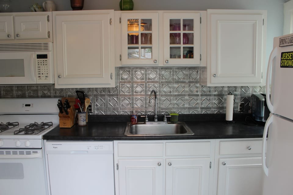 Kitchen with Dishwasher, oven and fridge.