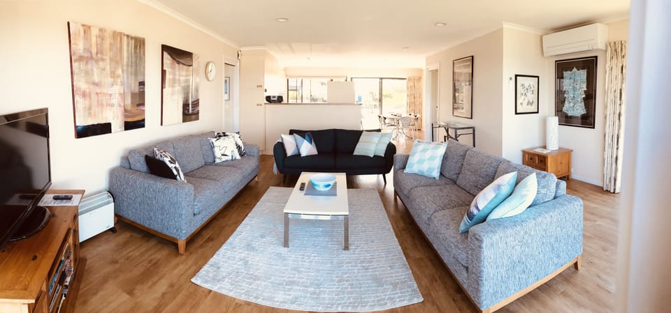 Open plan living, kitchen and dining.