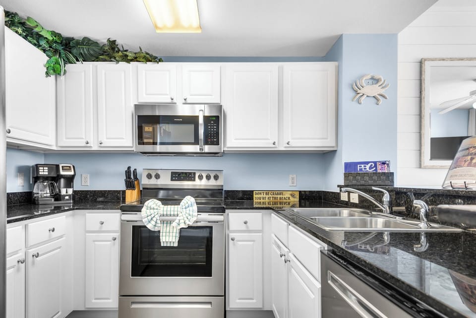 Kitchen - Whether a quick breakfast or a gourmet dinner, this kitchen delivers with modern appliances and full amenities for every meal.