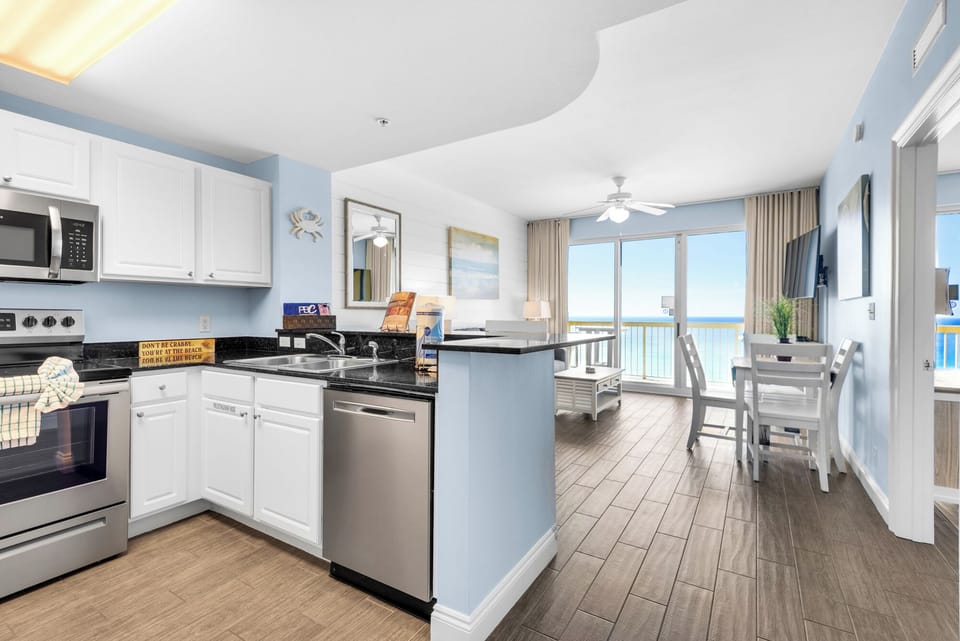 Living Room -Experience luxury and comfort in this beachfront retreat with a large flat-screen TV, chic decor, and stunning views of the ocean right from your couch.
