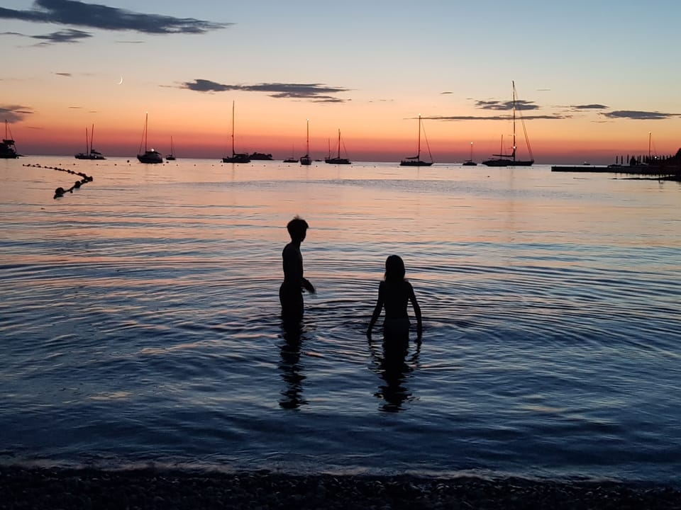 A dip in the warm Adriatic beneath another Rovinj sunset.