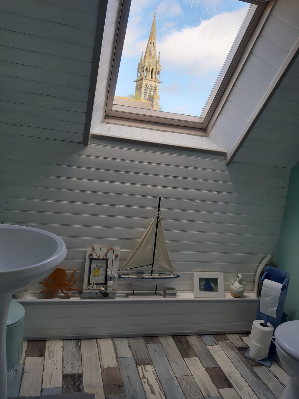 Nautical themed bathroom with view of the church spire