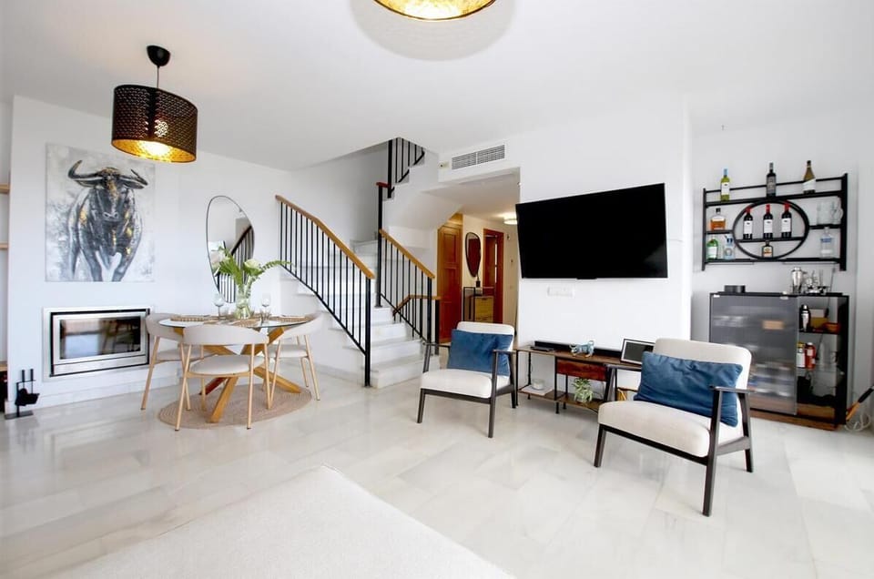 Another picture of the modern living room with dining area to the rear