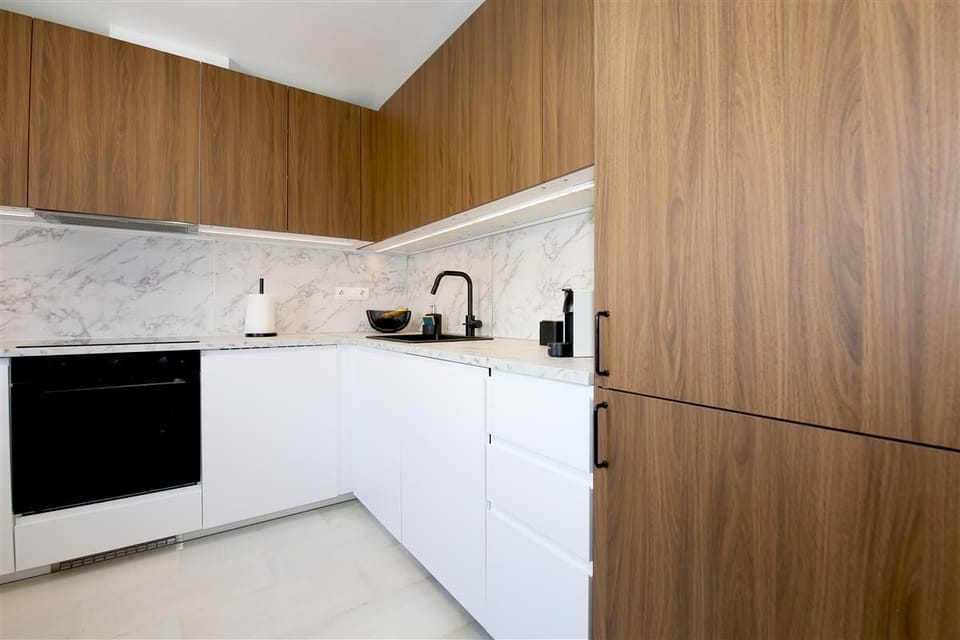 Kitchen in this house is fully fitted with all the appliances