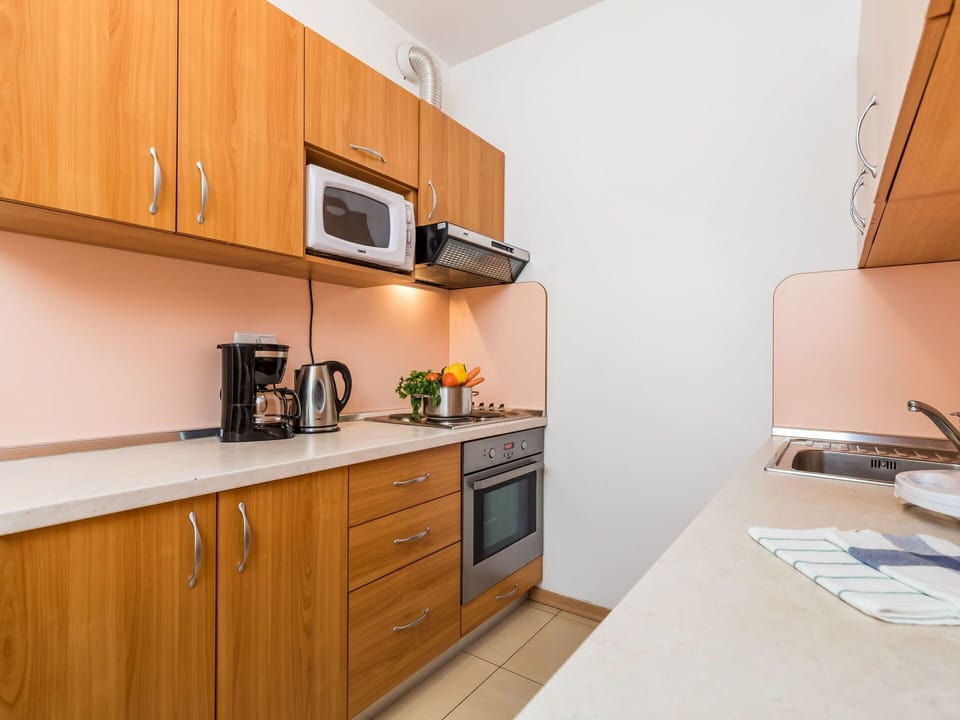 Countertop, Property, Cabinetry, Room, Kitchen, Furniture, Yellow, Interior Design, House, Building