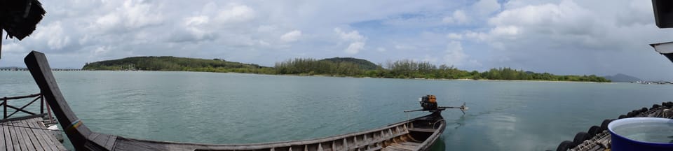 Longtail boat off the Kruvit Raft floating seafood restaurant