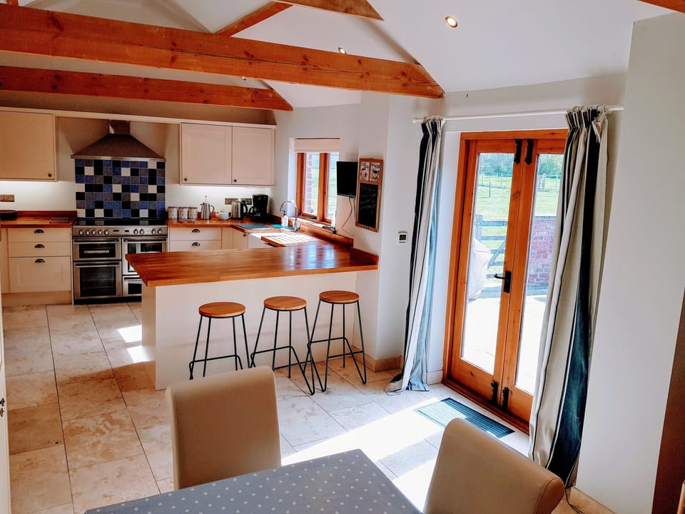 Dining kitchen with doors to courtyard. 