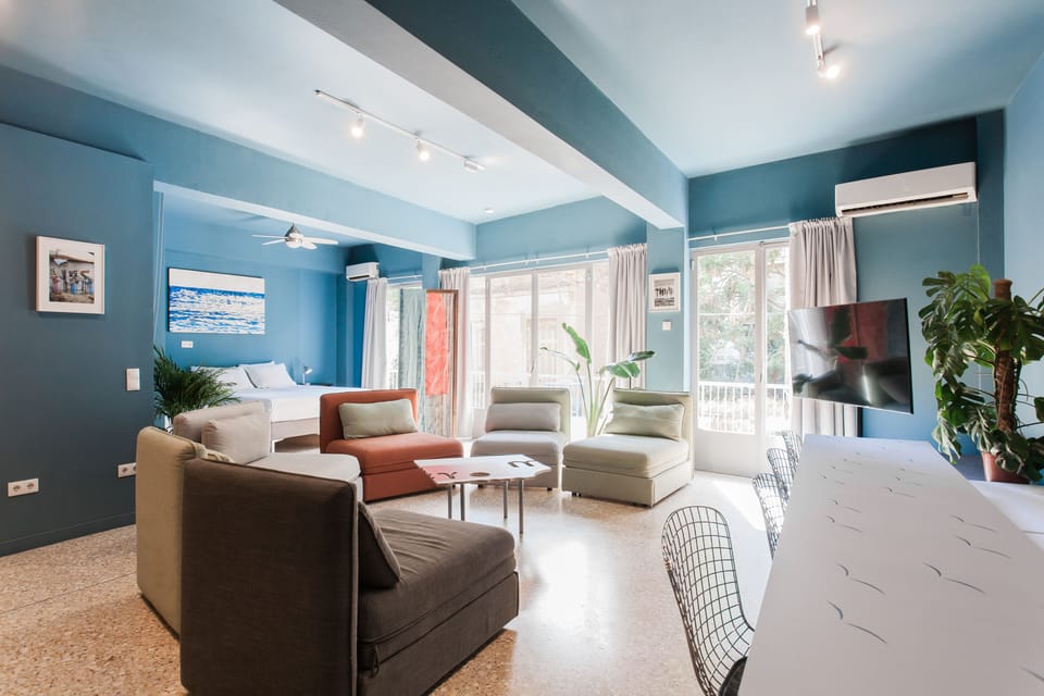 1st floor apt: Living room with sofa beds, double bed and single bed 