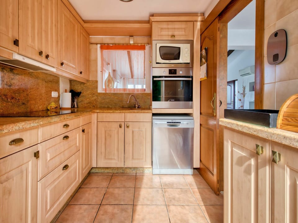 Brown, Countertop, Cabinetry, Property, Furniture, Kitchen Appliance, Kitchen, Wood, Kitchen Stove, Interior Design