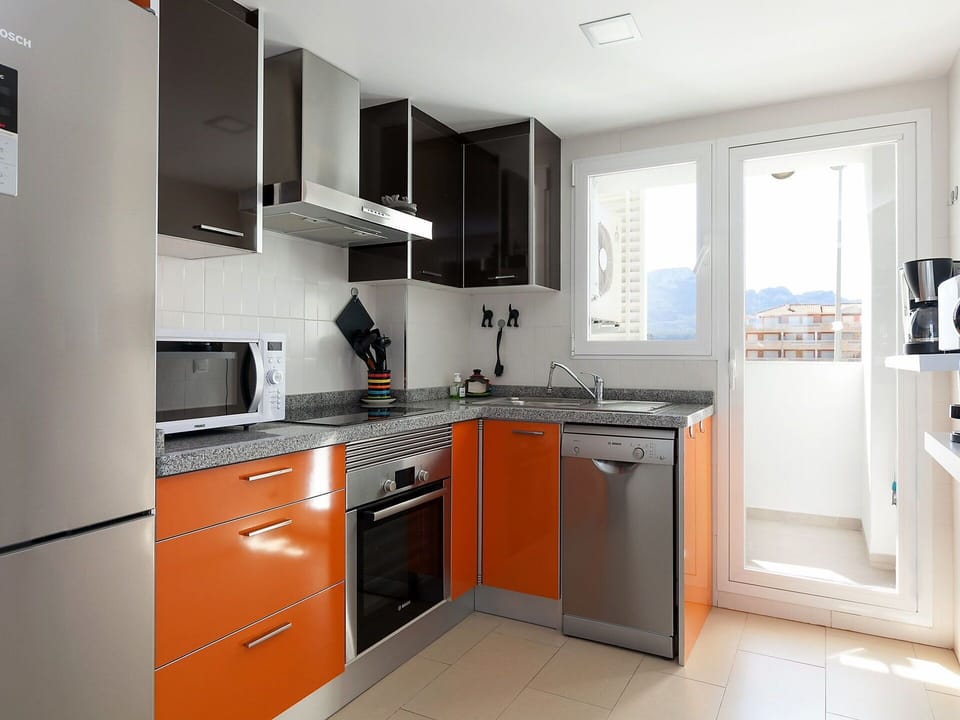 Room, Cabinetry, Property, Kitchen, Furniture, Countertop, Interior Design, Major Appliance, Building, Orange