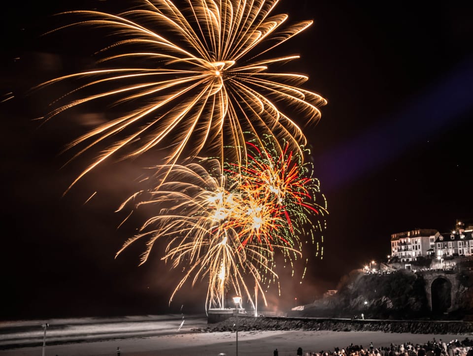 Looe town pier fireworks over New Year