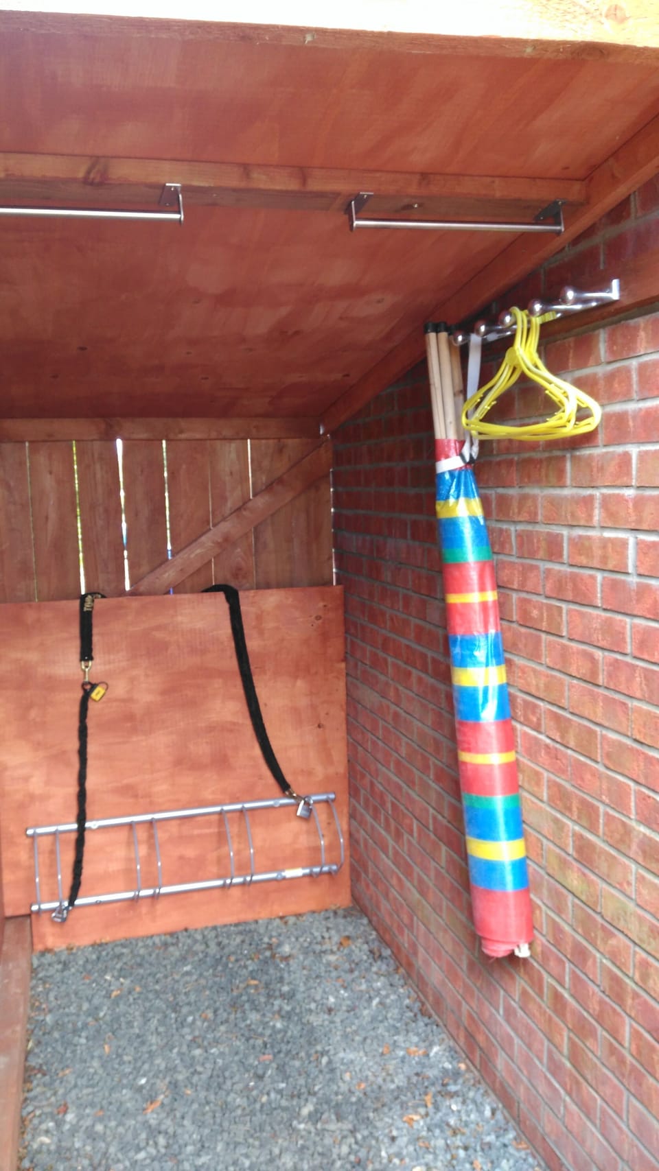 Bike store with hanging space for wetsuits or other wet garments.