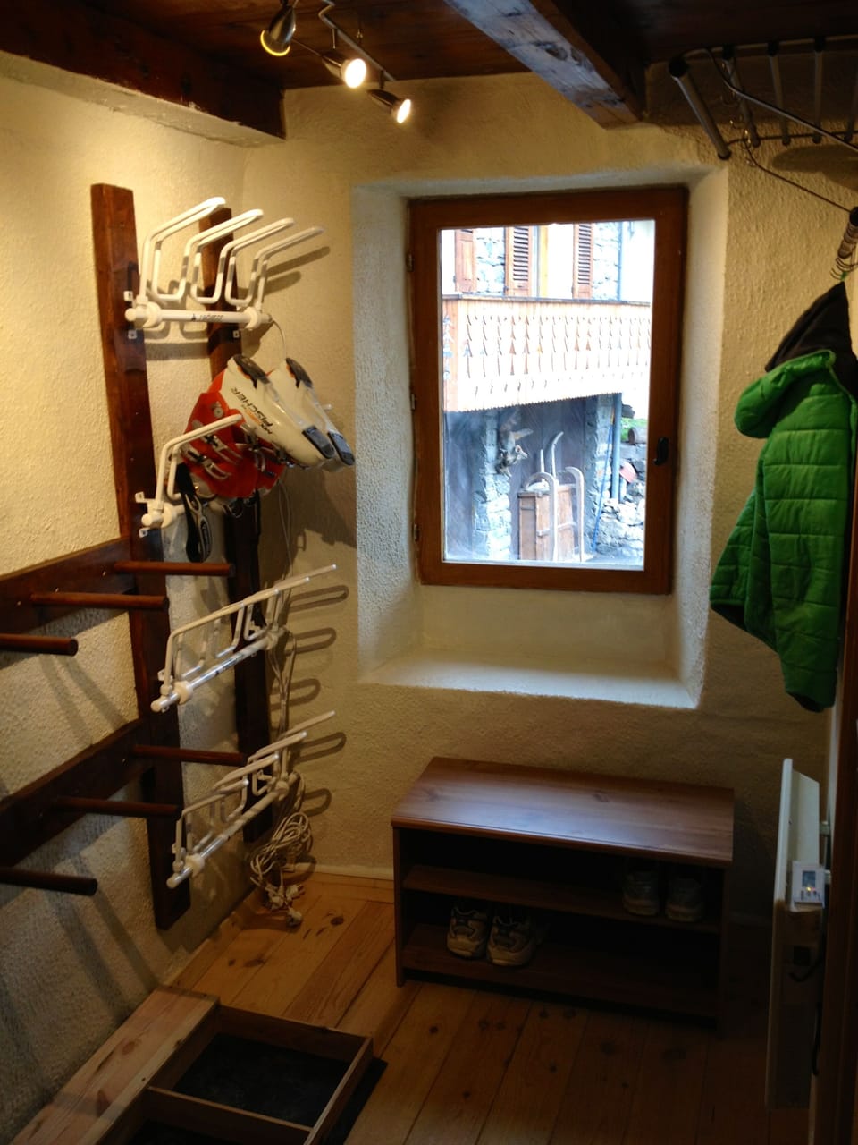 The hall with boot warmers and ski rack