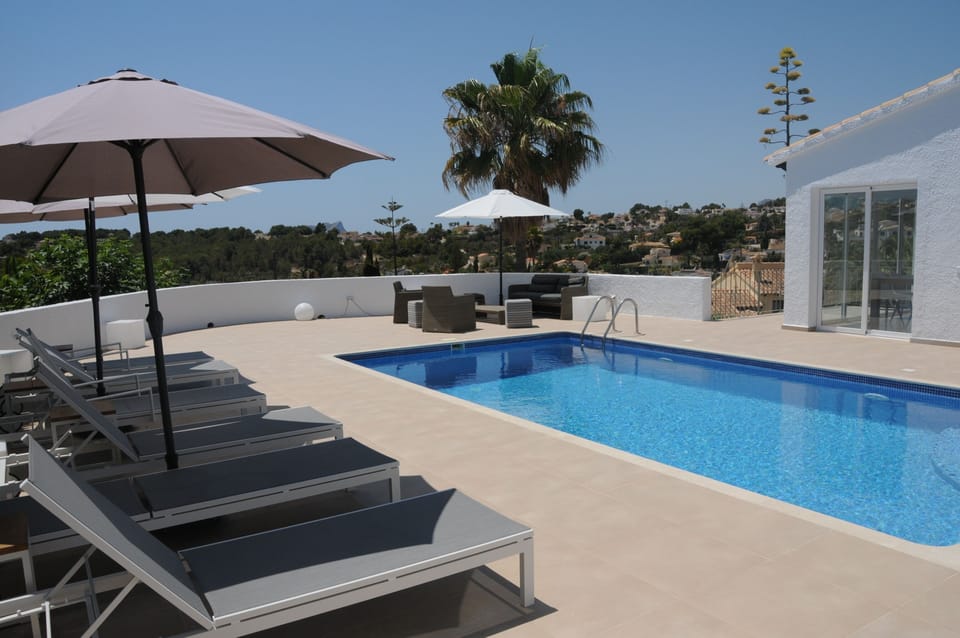 Terrace with sunbeds and outdoor lounge