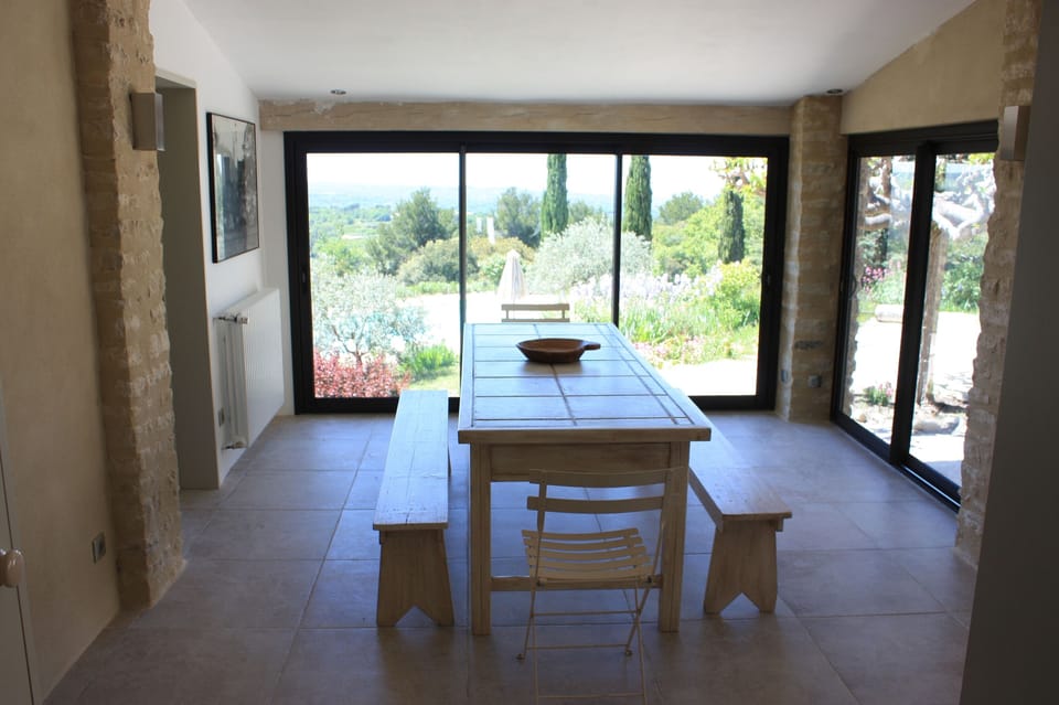 Kitchen table with french windows on to terrace