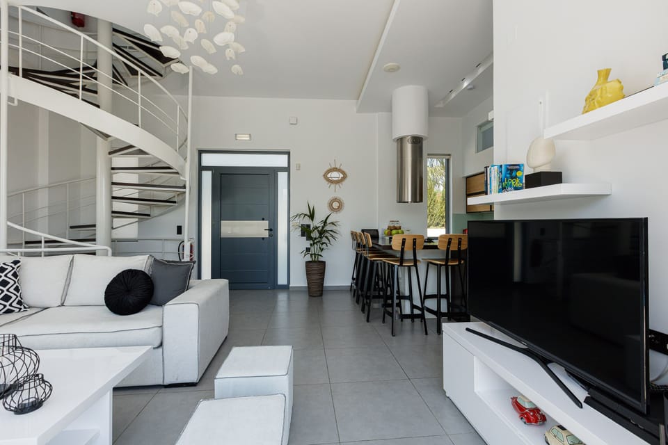 Living room settings for gatherings featuring a flat screen TV.