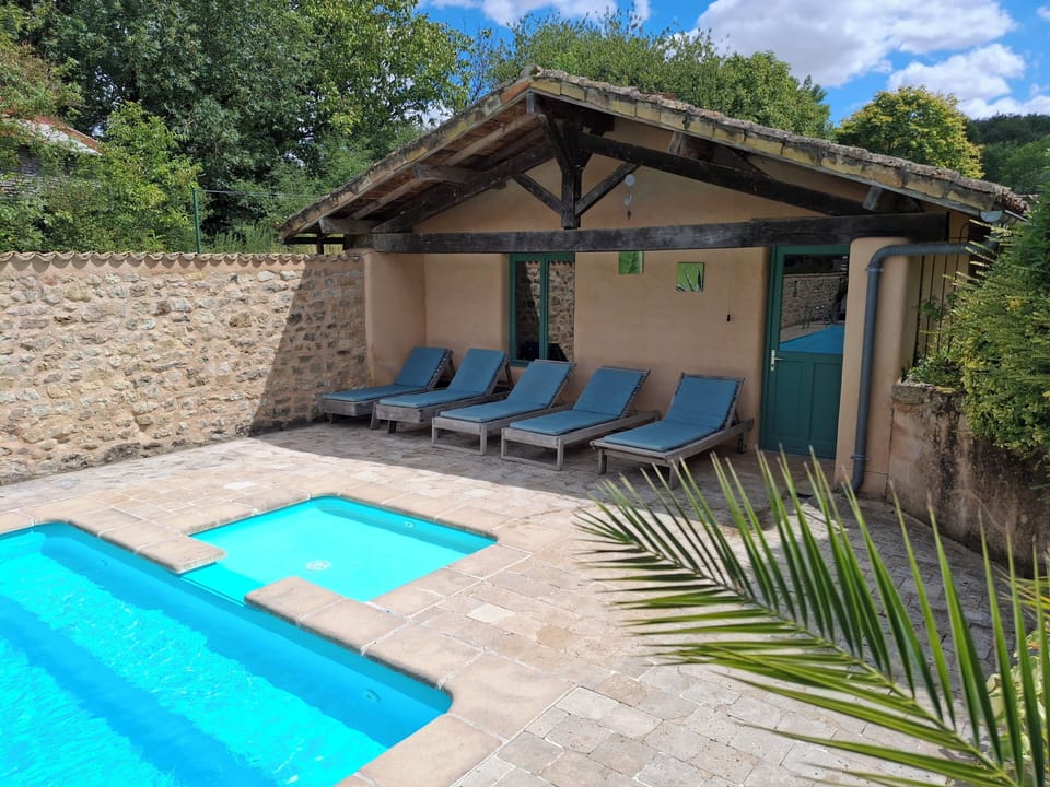 Pool area with baby pool and plenty of shade by the pool house