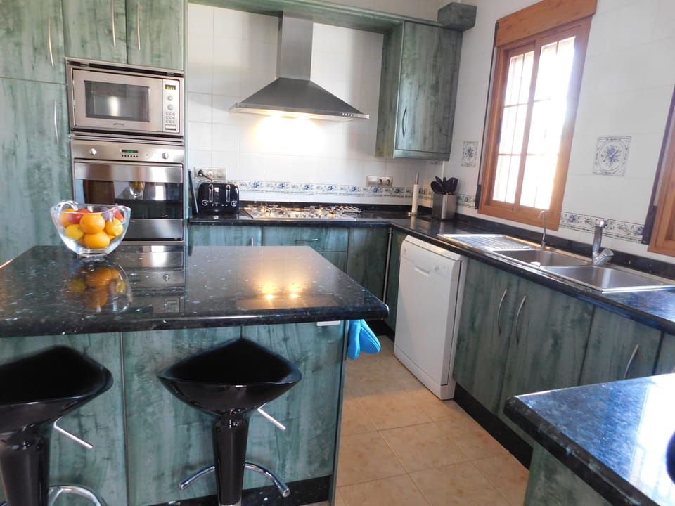 Kitchen (dishwasher, coffee pod, oven, hob, microwave, fridge, freezer