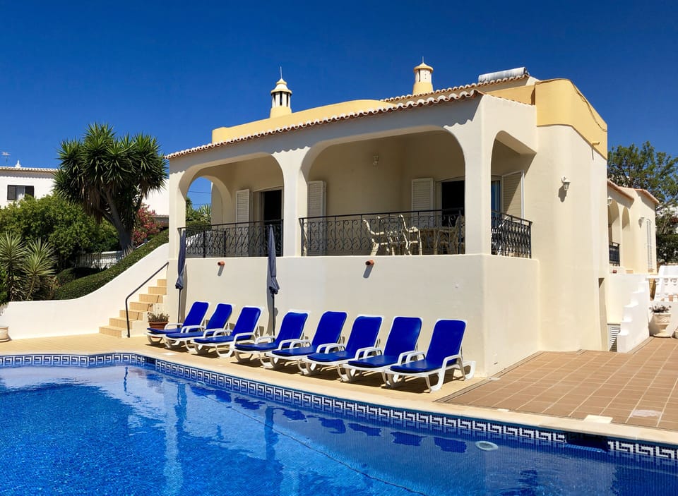 8 sun-loungers and 2 parasols