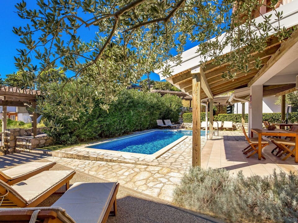 Plant, Furniture, Azure, Outdoor Furniture, Botany, Shade, Swimming Pool, Building, Chair, Water