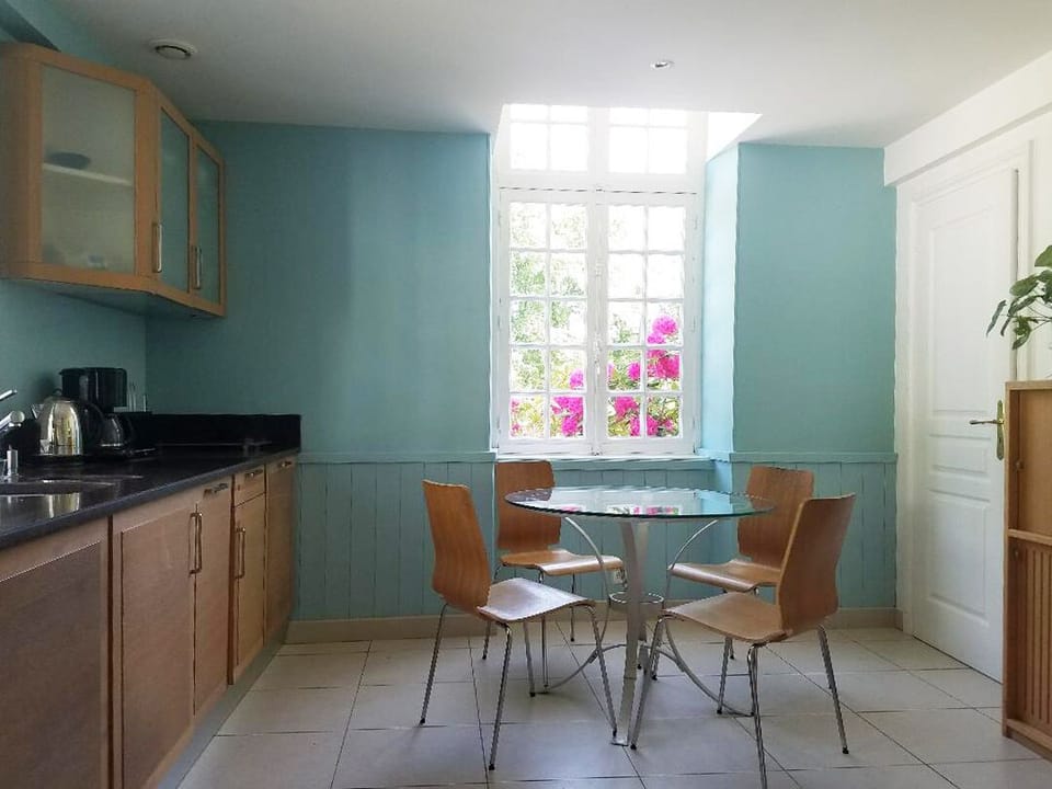 Manor House apartment with dining area.