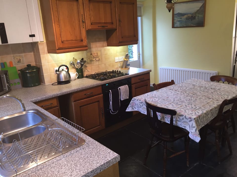 Kitchen with door leading to private riverside patio