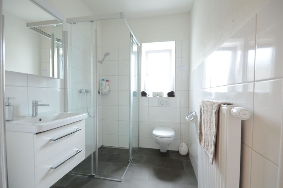 New.  Shower bathroom with hairdryer.