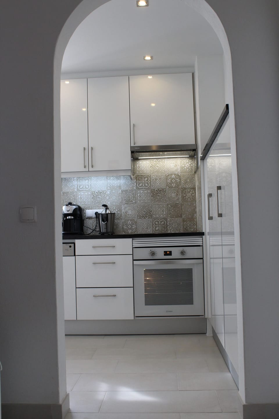 View of kitchen showing lighting and additional cupboards