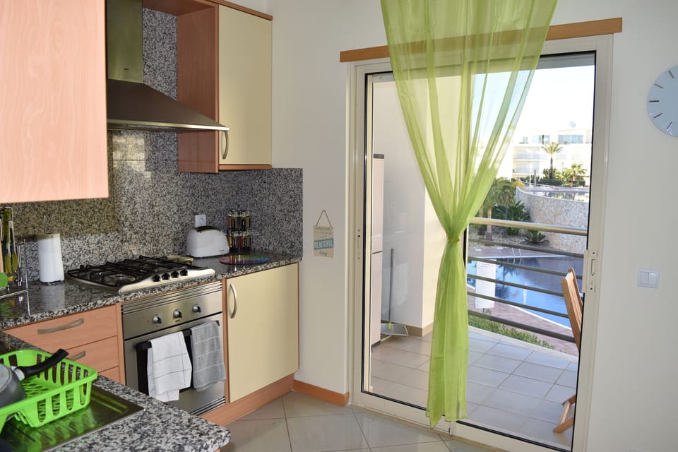 Kitchen Balcony overlooks the pool