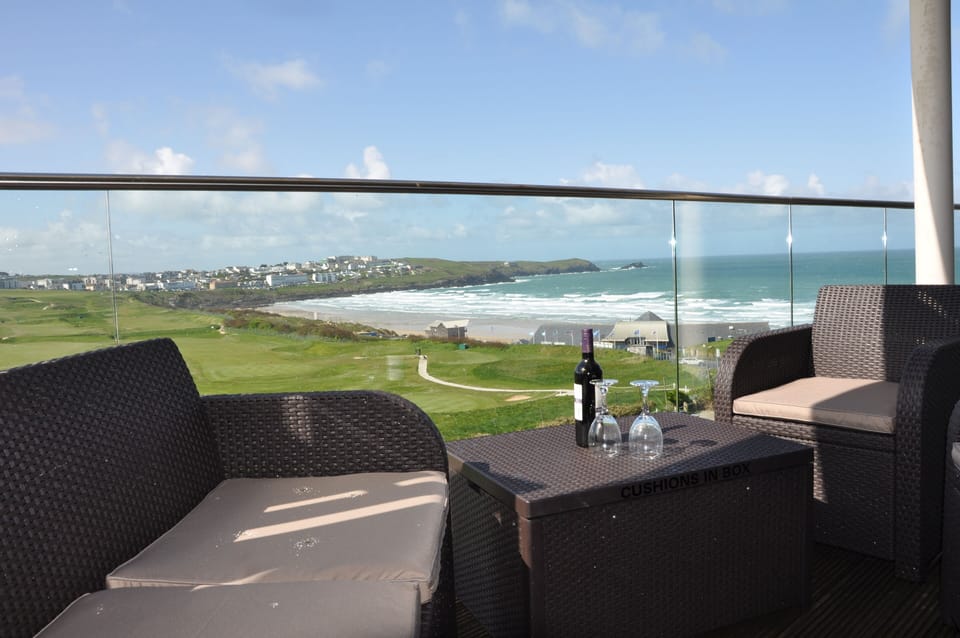 Balcony Furniture with Golf Course and Beach Behind