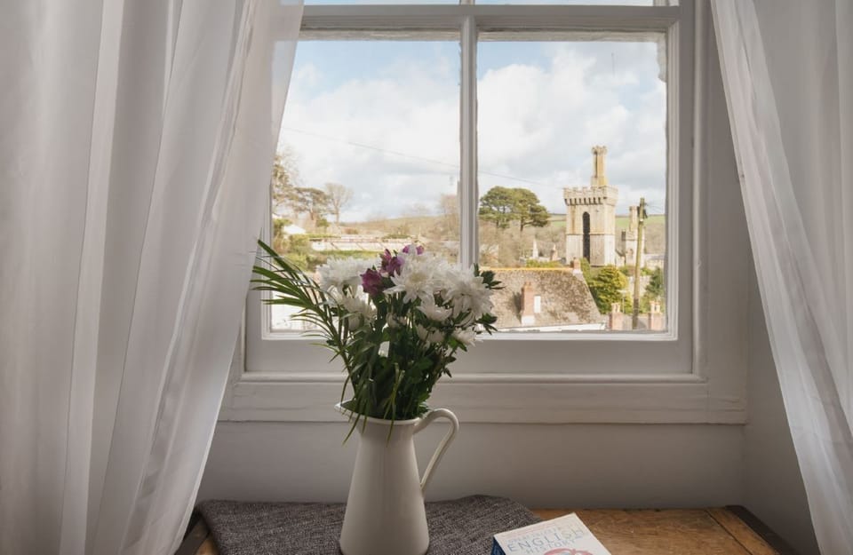 views to Place, Fowey Harbour, the estuary and hills beyond.