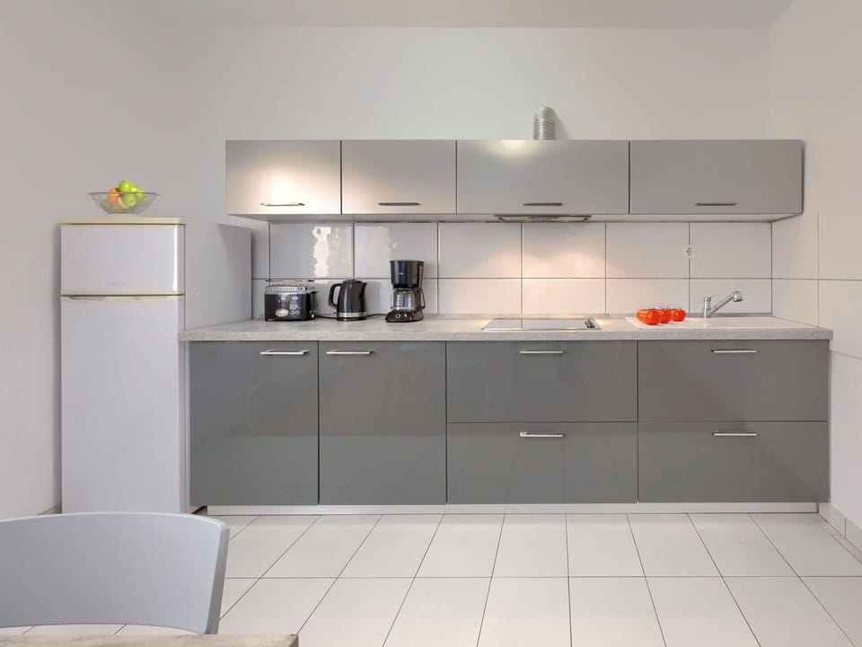 Cabinetry, Countertop, Property, Sink, Building, Tap, Kitchen Stove, Kitchen Sink, Home Appliance, Kitchen Appliance